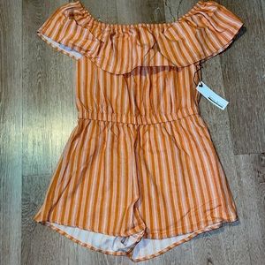 Young contemporary off shoulder romper with white design.